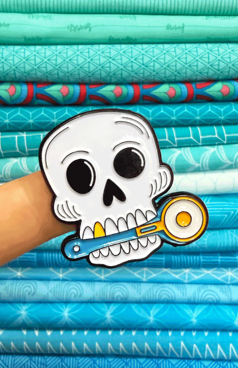 Skull with Rotary Cutter Enamel Pin